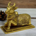 100% Pure Brass Sitting Nandi Cow Statue – Handcrafted Spiritual Home Décor Showpiece (4.5 Inch)