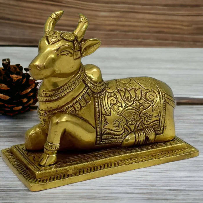 100% Pure Brass Sitting Nandi Cow Statue – Handcrafted Spiritual Home Décor Showpiece (4.5 Inch)