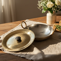 Brass and silver lids on a wooden surface