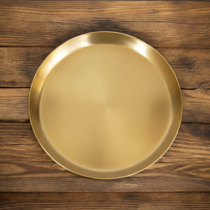 Gold plate on a wooden surface
