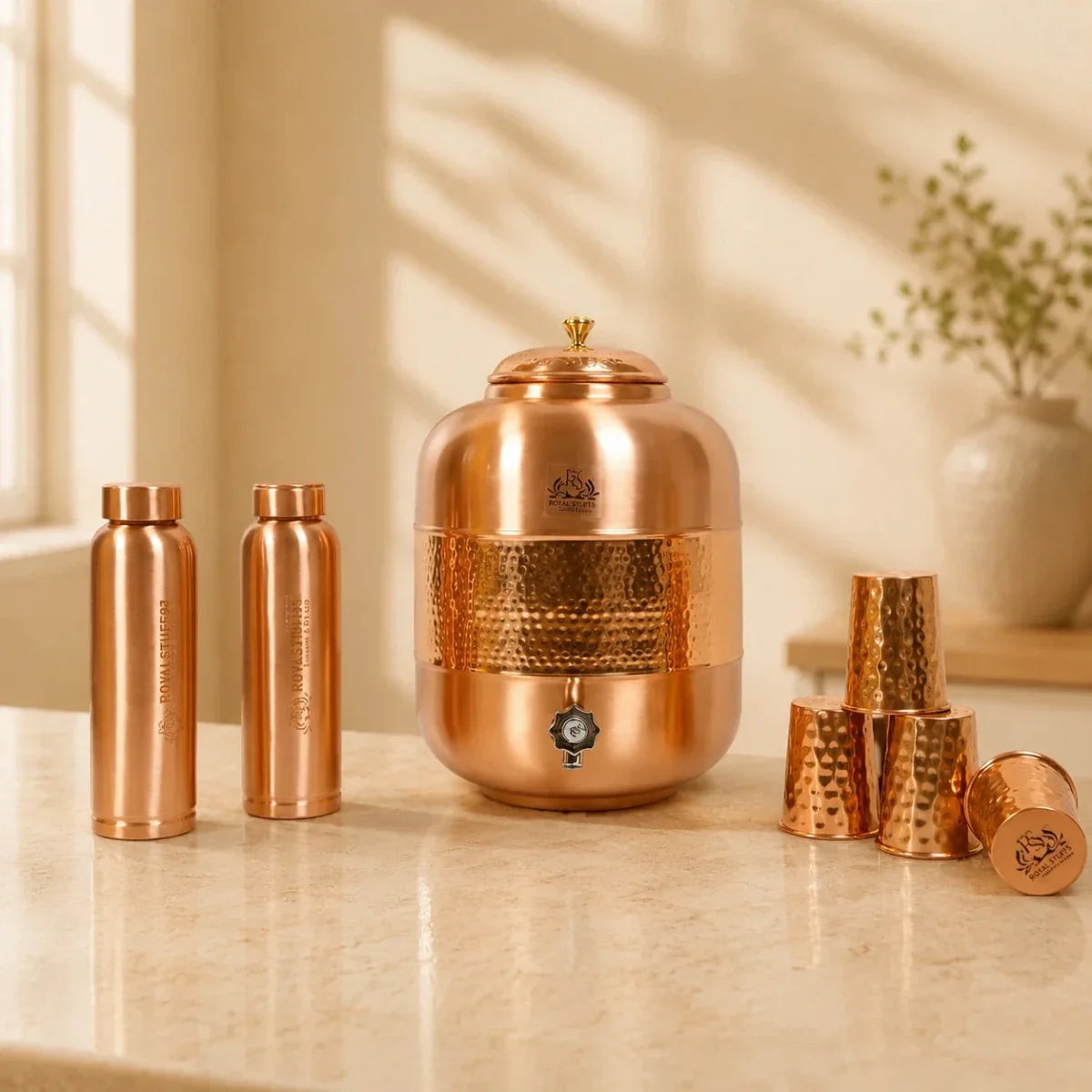 RoyalStuffs Pure Copper Water Dispenser Set – Hammered 8 Liter Copper Storage Tank with 4 Tumblers & 2 Bottles